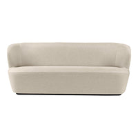 Beige curved sofa with a smooth, minimalist design and no visible patterns. Elegant and modern furniture piece.