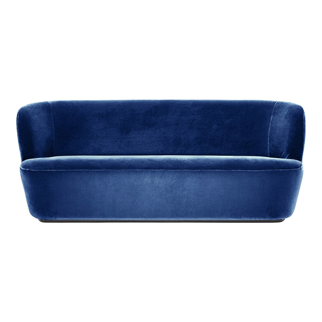 Elegant deep blue velvet sofa with a sleek, modern design and smooth, rich texture. Perfect for contemporary decor.