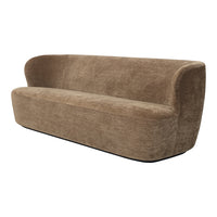 Soft beige sofa with a smooth texture and curved design, perfect for modern living spaces.