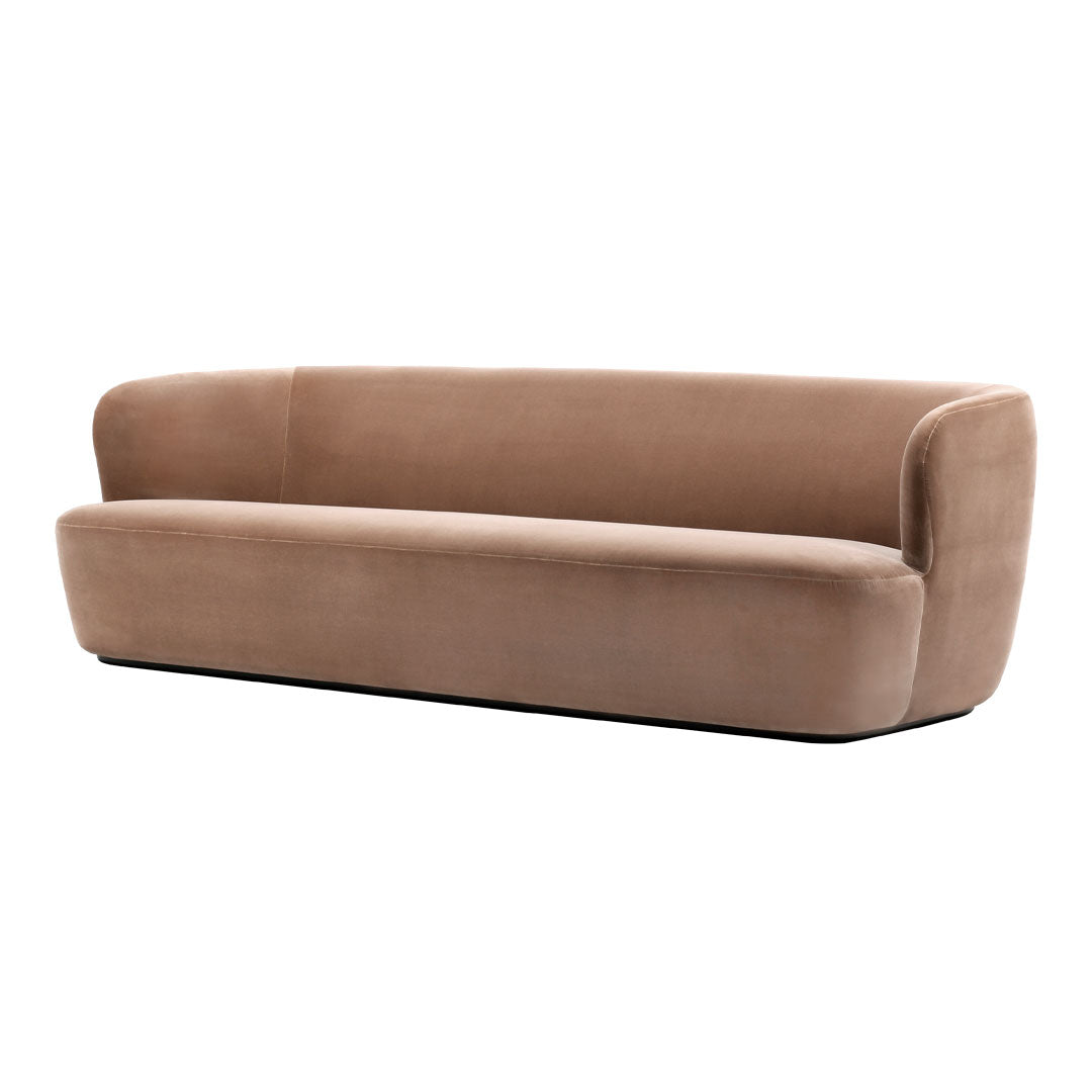 Soft beige velvet sofa with smooth, clean lines and a contemporary, minimalist design.
