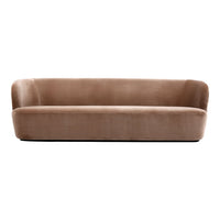 Brown velvet sofa with a smooth, textured surface and minimalist design. Perfect for modern living spaces.