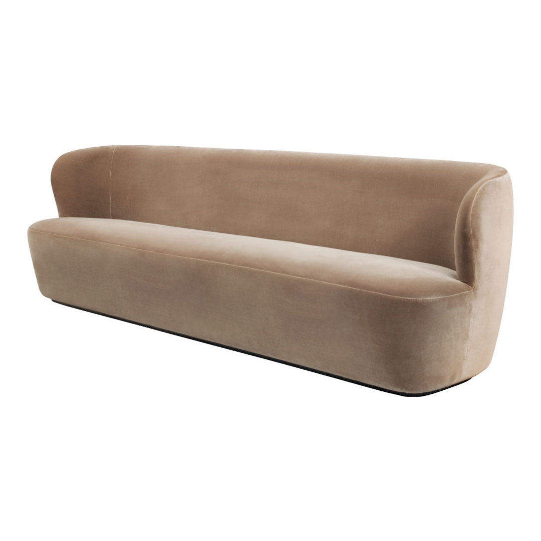 Beige velvet sofa with a sleek, minimalist design and smooth, rounded edges. Perfect for modern interiors.