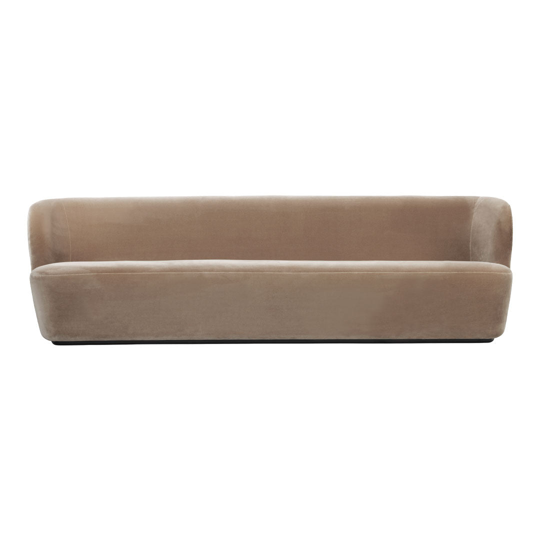 Soft beige velvet sofa with a sleek, minimalist design, perfect for modern interiors.