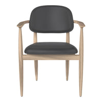 Black leather chair with a wooden frame, featuring a smooth surface and minimalistic design. Perfect for modern decor.