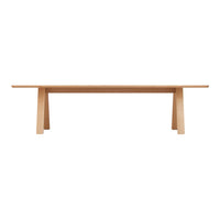 Light natural wood dining table with a simple, minimalist design and smooth surface. Perfect for modern decor.