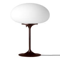 Modern white glass lamp on a brown base, featuring a sleek, minimalist design. Perfect for contemporary decor.