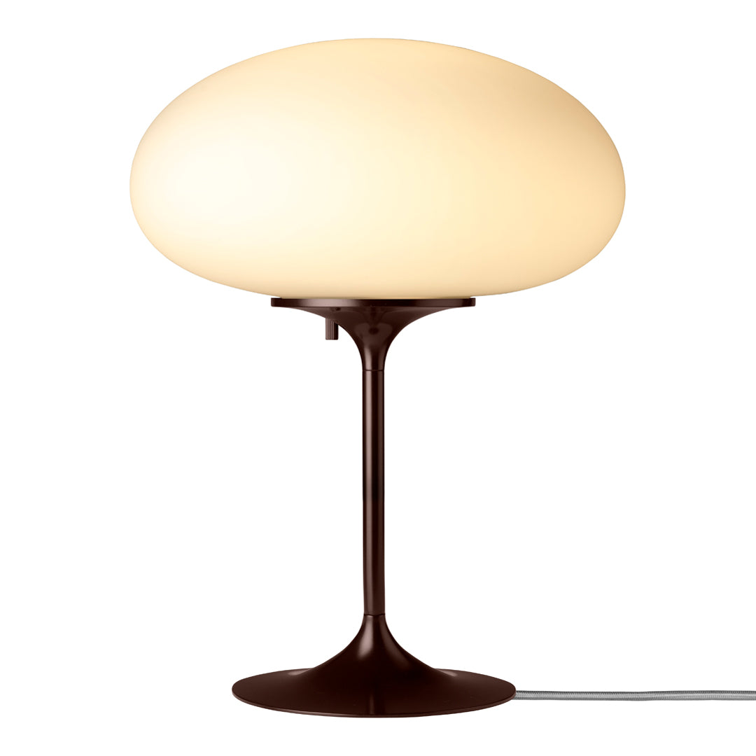 Stylish modern lamp featuring a smooth cream orb shade and a sleek dark brown base. Perfect for contemporary decor.
