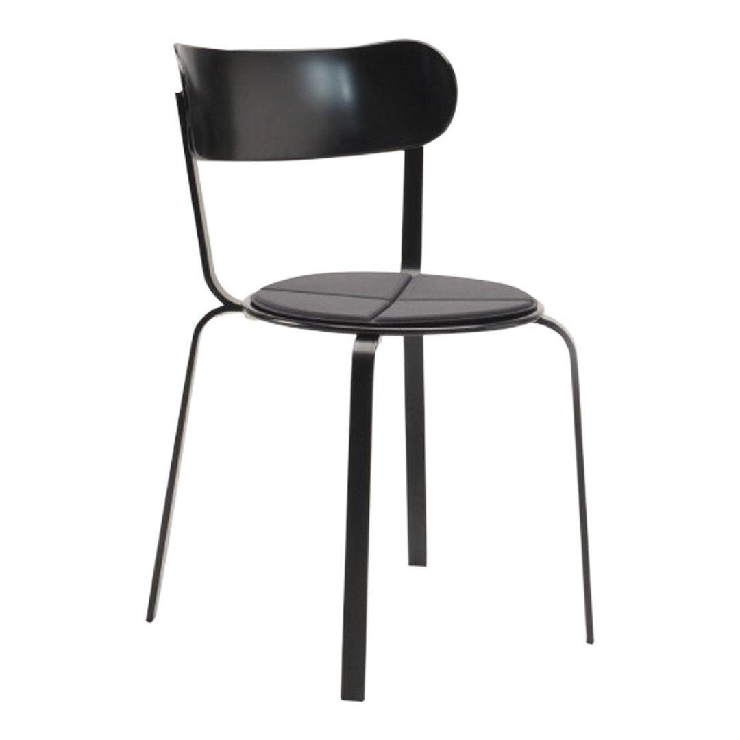 Black metal chair with a sleek, minimalist design and smooth surface, featuring a curved backrest and round seat.