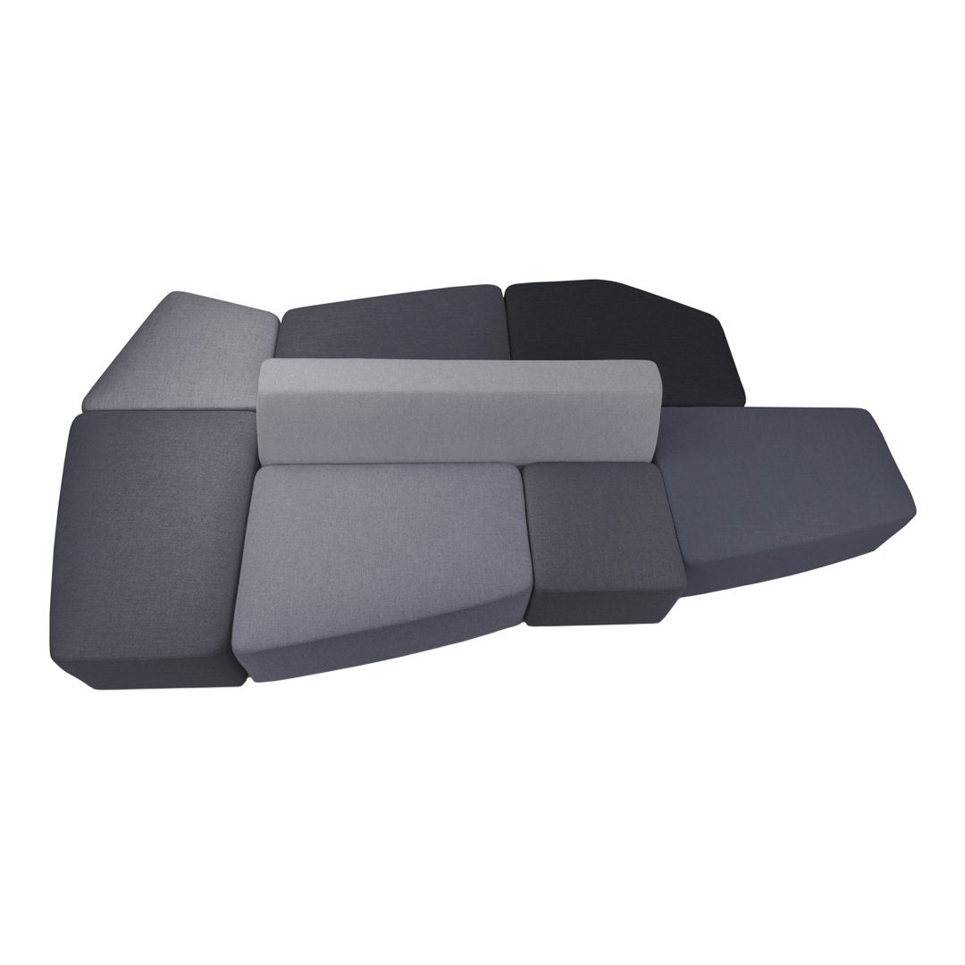 "Geometric foam seating in varying shades of gray, featuring a modern, textured pattern."