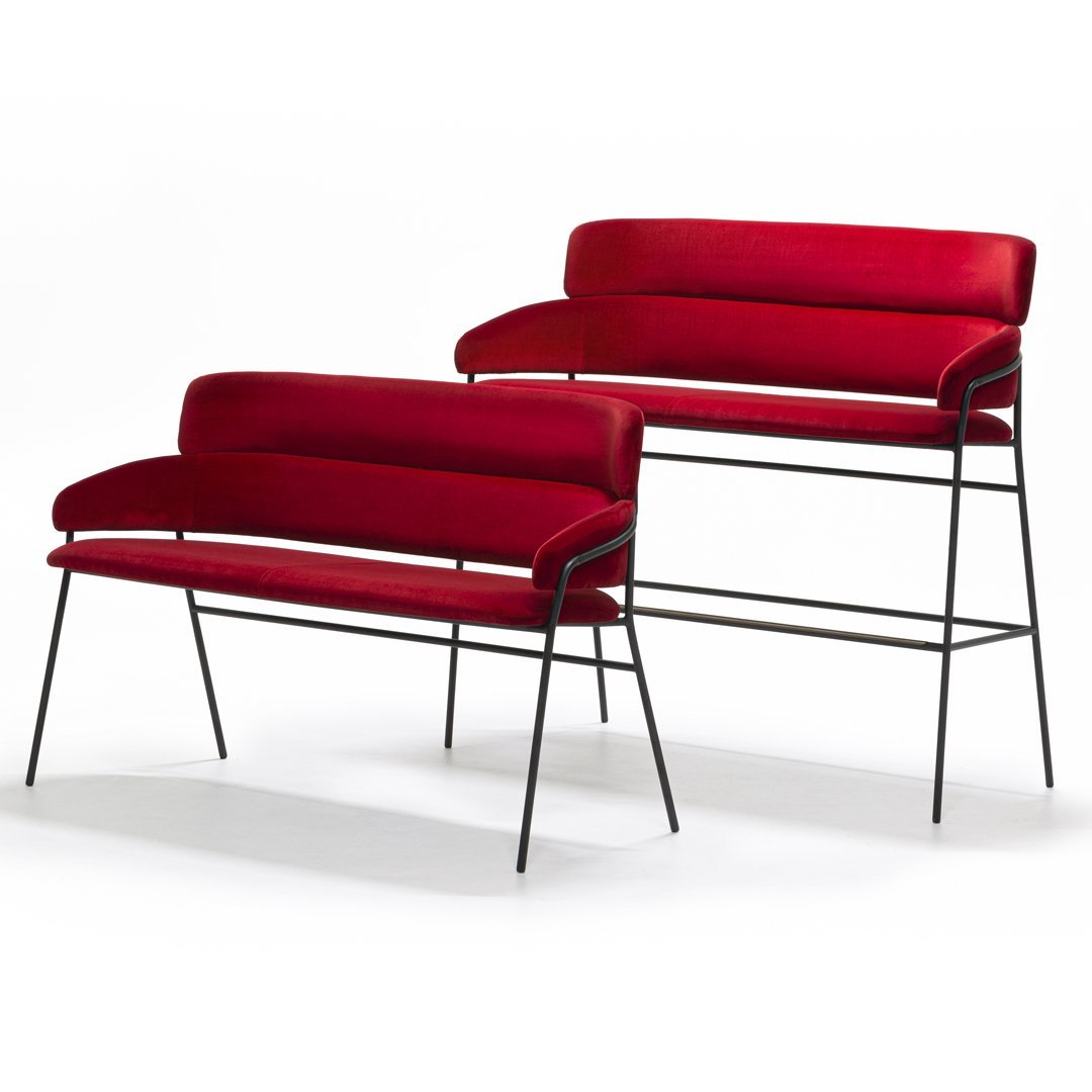 "Set of two modern red velvet benches with sleek black metal legs, showcasing a minimalist design."