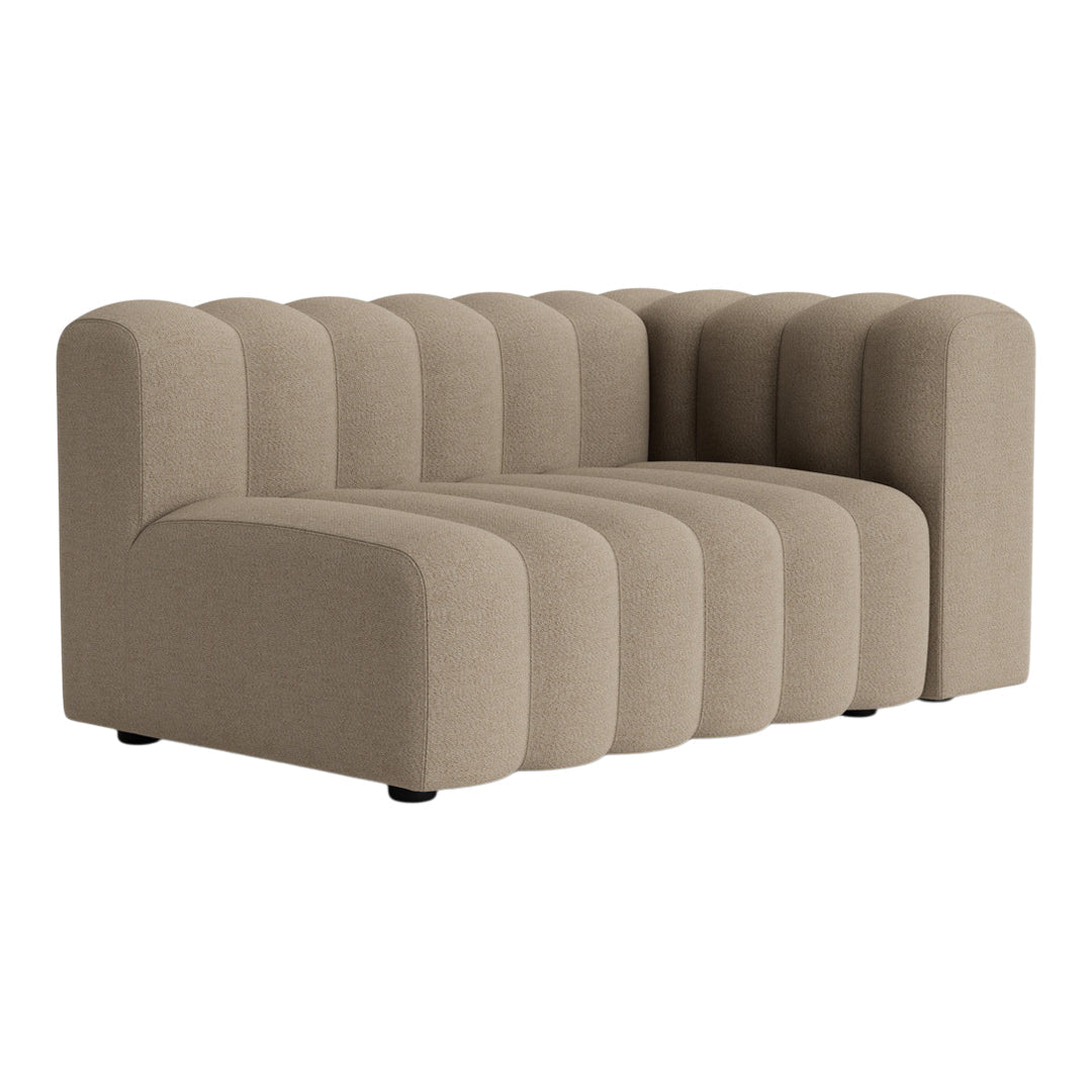 Beige ribbed sofa featuring curved lines and a modern, plush design for stylish comfort.