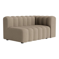 Beige ribbed sofa featuring curved lines and a modern, plush design for stylish comfort.