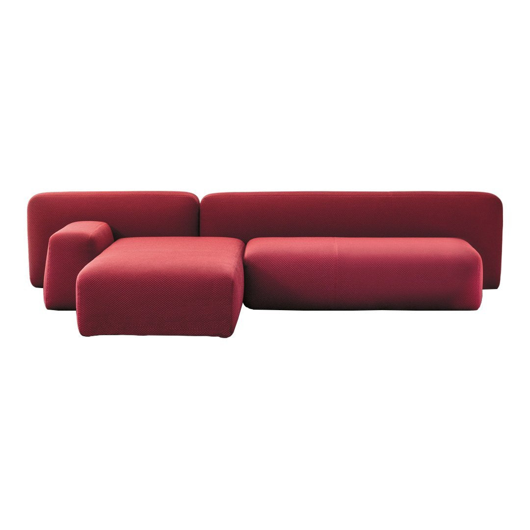 Red modern sectional sofa with sleek, minimalistic design and smooth upholstery. Perfect for contemporary living spaces.