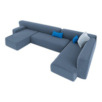 Stylish L-shaped couch in a soft gray fabric with blue and white accent pillows, featuring a minimalist design.