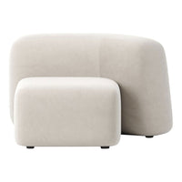 Beige curved sofa set featuring a soft, smooth texture and minimalistic design, perfect for modern interiors.