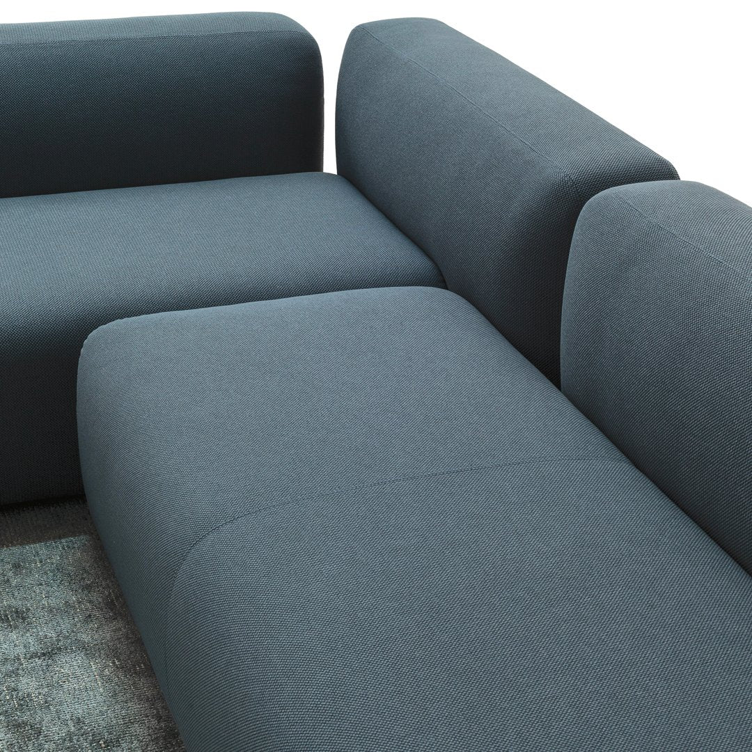 "Modern dark gray sectional sofa with smooth fabric and minimalist design."