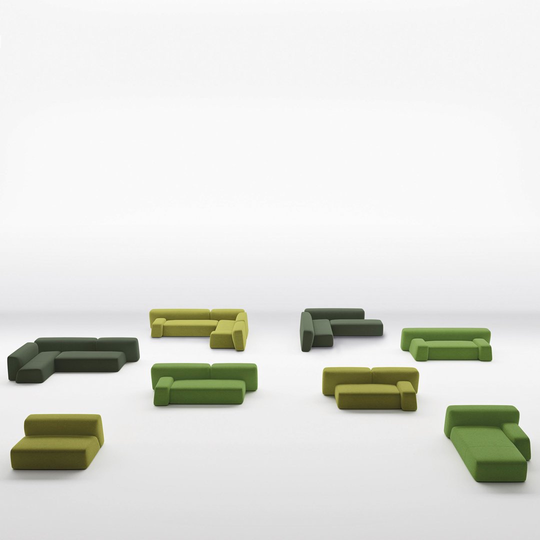 "Varied green and yellow modular sofa pieces arranged creatively, showcasing modern design and textural patterns."