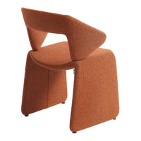 Rust orange chair with a textured finish and modern geometric shape, ideal for contemporary interiors.