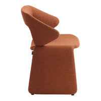 "Modern terracotta upholstered chair with a sleek, sculptural design and textured fabric."