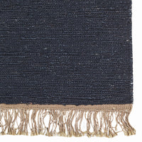 Navy blue textured rug with golden fringes, featuring a subtle woven pattern for an elegant touch.