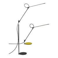 "Modern black lamp with yellow accents and circular design, featuring sleek lines and minimalistic style."