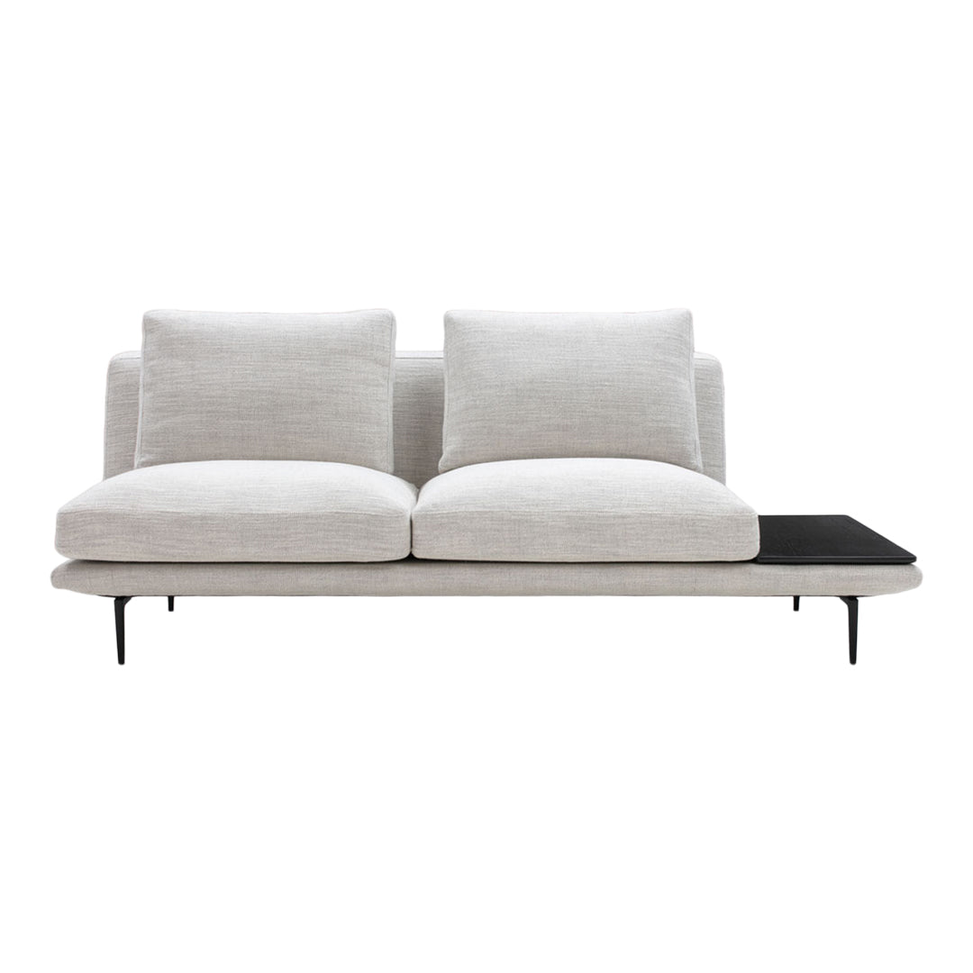 Modern light gray sofa with plush cushions and a sleek black wooden side table. Stylish, minimalistic design.