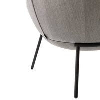 Gray textured upholstery with a modern rounded design and sleek black metal legs. Perfect for contemporary decor.