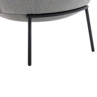 Gray upholstered chair with a smooth texture and sleek black metal legs. Modern design with a minimalist aesthetic.