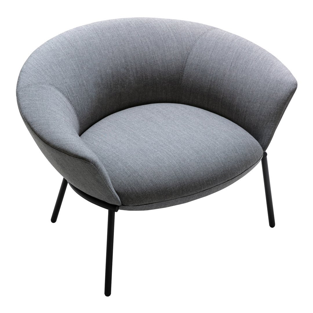 Gray upholstered lounge chair with a curved design and sleek black metal legs. Simple, modern, and stylish.