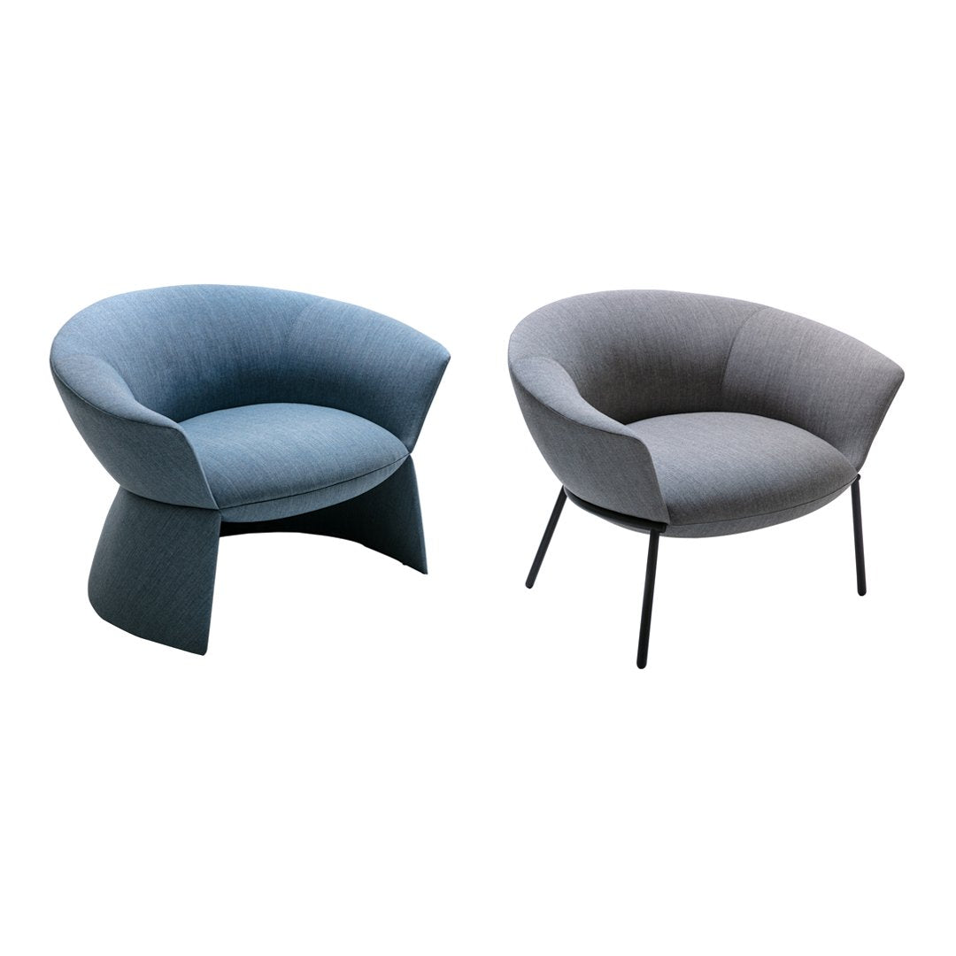 Two modern chairs in soft light blue and grey upholstery with minimalist patterns and sleek black legs.