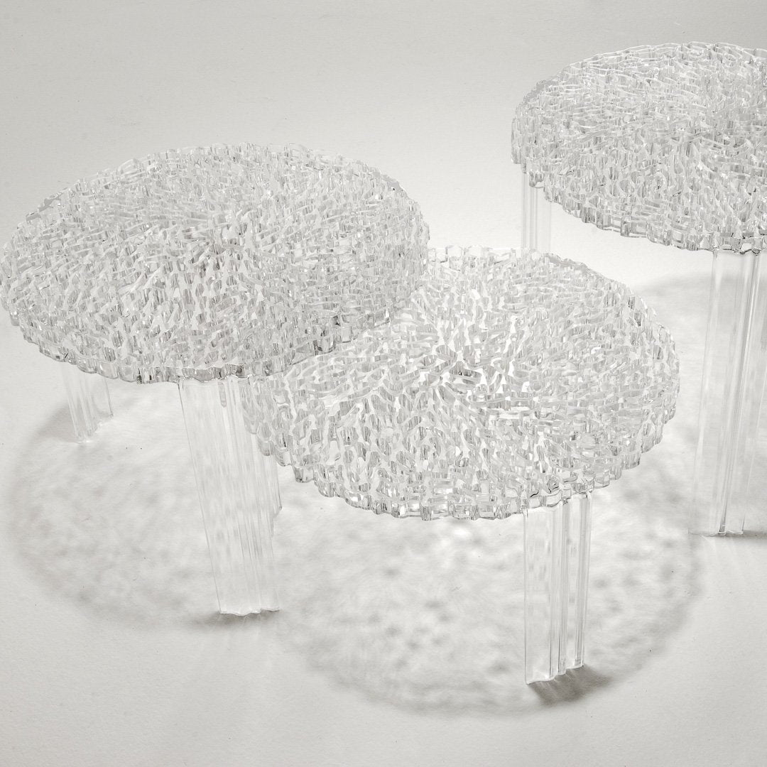 Clear textured stools with intricate bubble-like patterns and transparent legs, creating a modern and stylish look.
