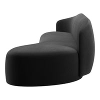 Curved black sofa with a smooth texture, highlighting modern minimalist design and seamless lines.