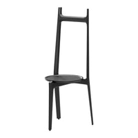 Sleek black chair with minimalist design and smooth surface, showcasing modern elegance and versatile style.