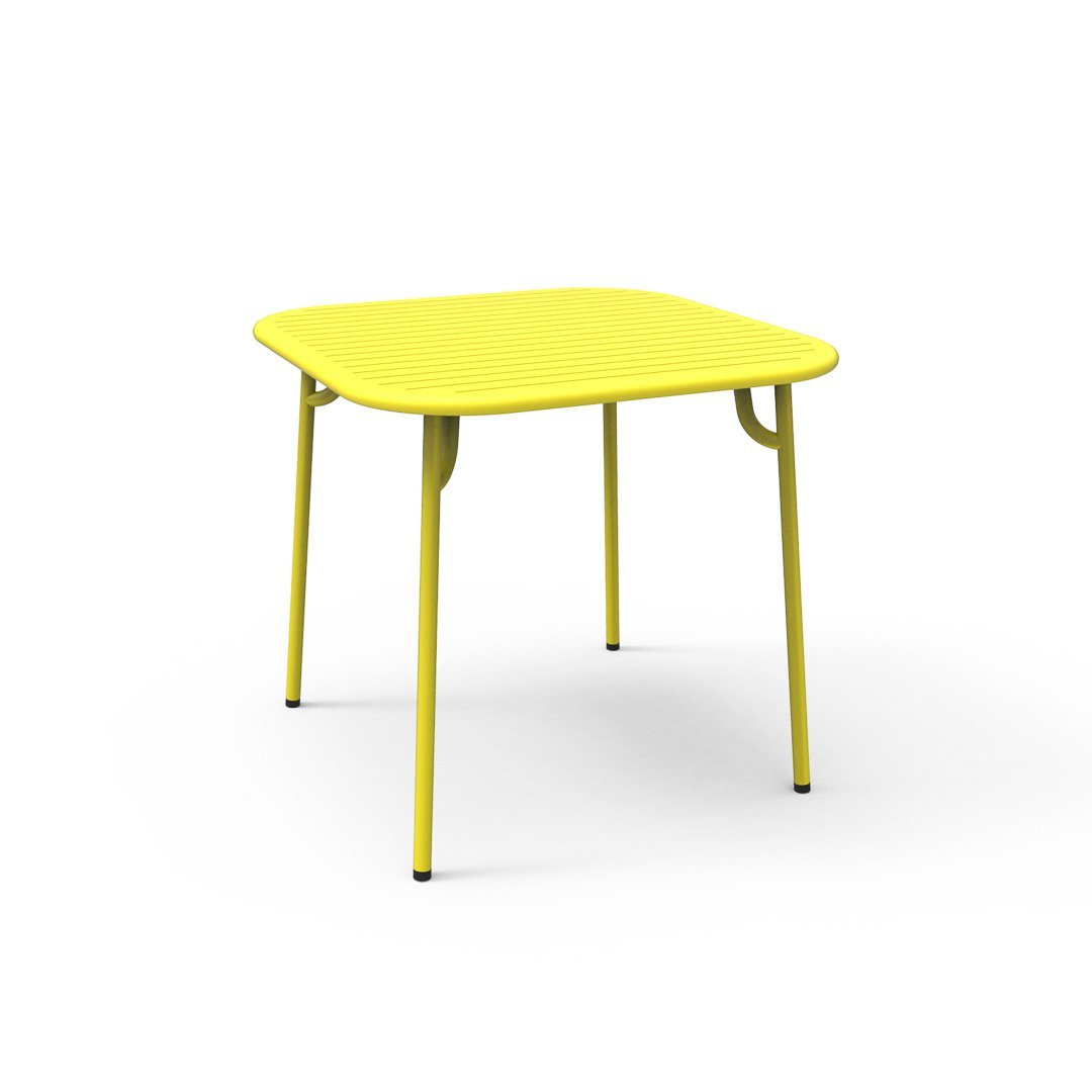 Bright yellow square table with a smooth surface and sleek, minimalistic design, perfect for modern spaces.