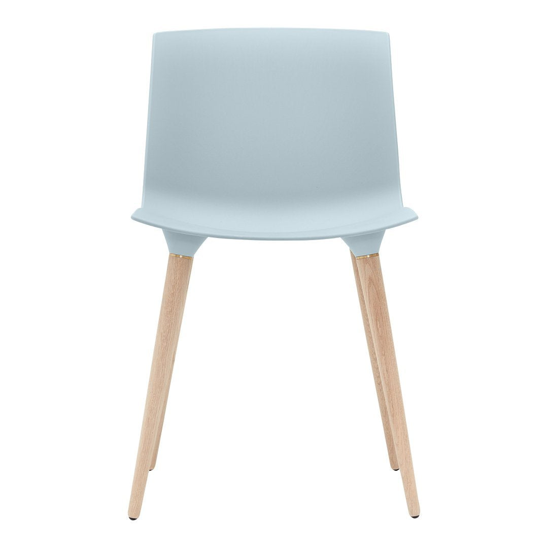 Light blue modern chair with a smooth finish and natural wooden legs. Minimalistic design for any space.