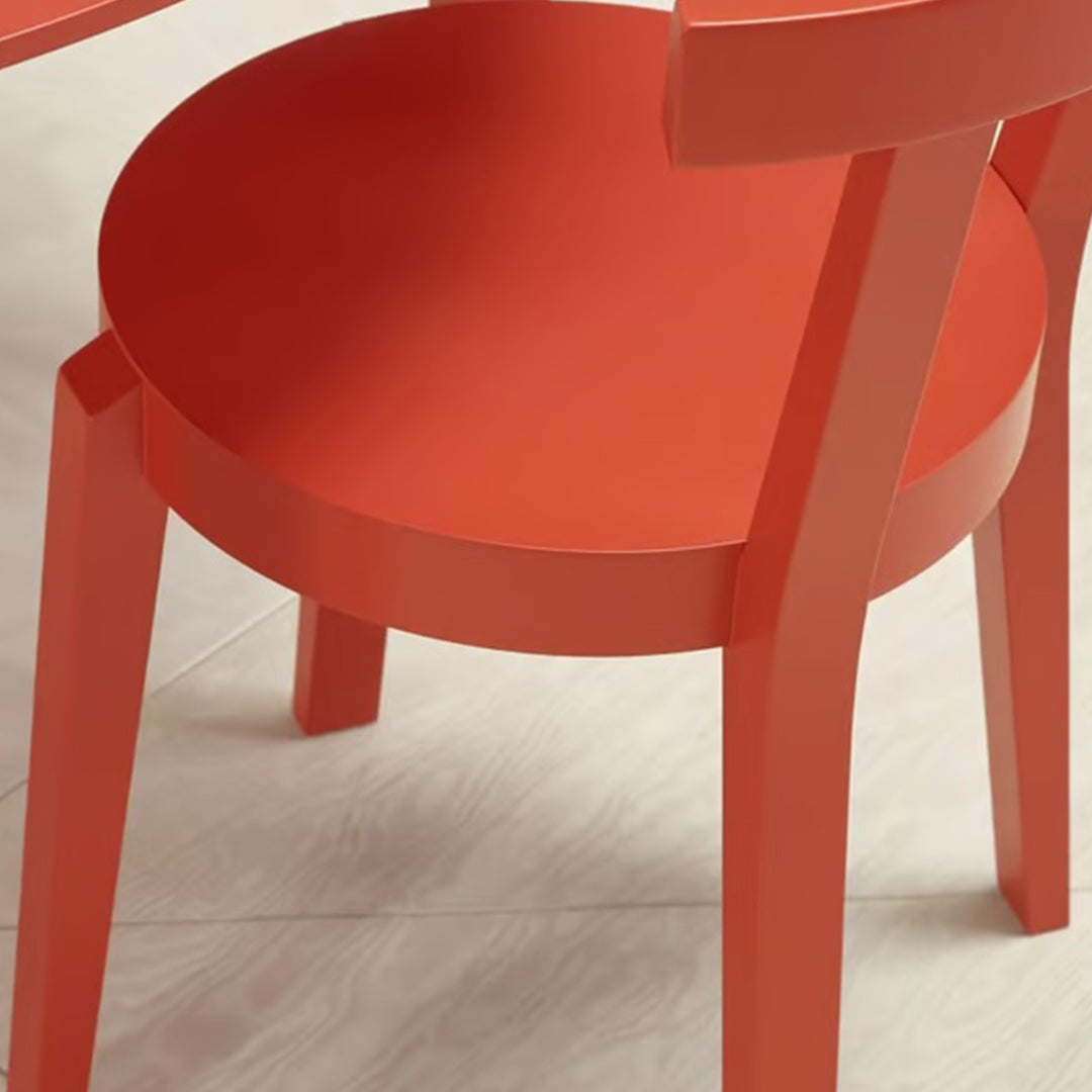 Vibrant red chair with a smooth, modern design and minimalist pattern, perfect for contemporary decor.
