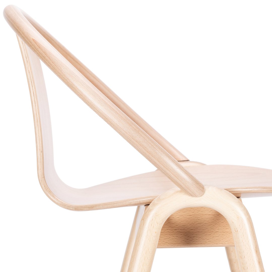 Light natural wood chair with smooth, minimalist curves and a simple, elegant design. Perfect for modern decor.