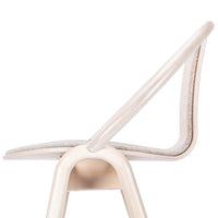 Light beige chair with a smooth curved backrest and subtle textured fabric pattern. Elegant and minimalistic design.