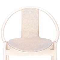 Light beige chair with subtle speckled pattern on the seat, creating a soft, textured appearance.