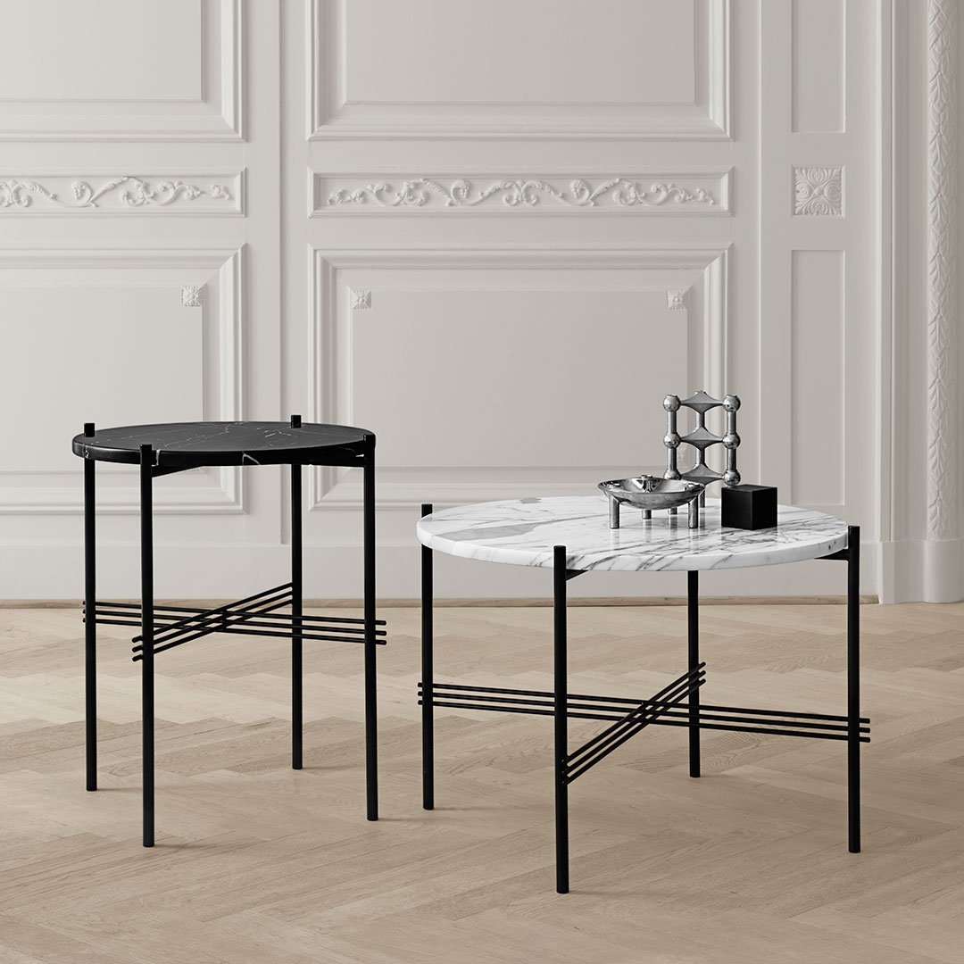 Modern black and white accent tables with sleek geometric patterns and elegant marble finishes.