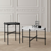 Modern black and white accent tables with sleek geometric patterns and elegant marble finishes.