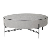 Round gray patterned coffee table with black metal legs and a sleek design. Perfect for modern decor.