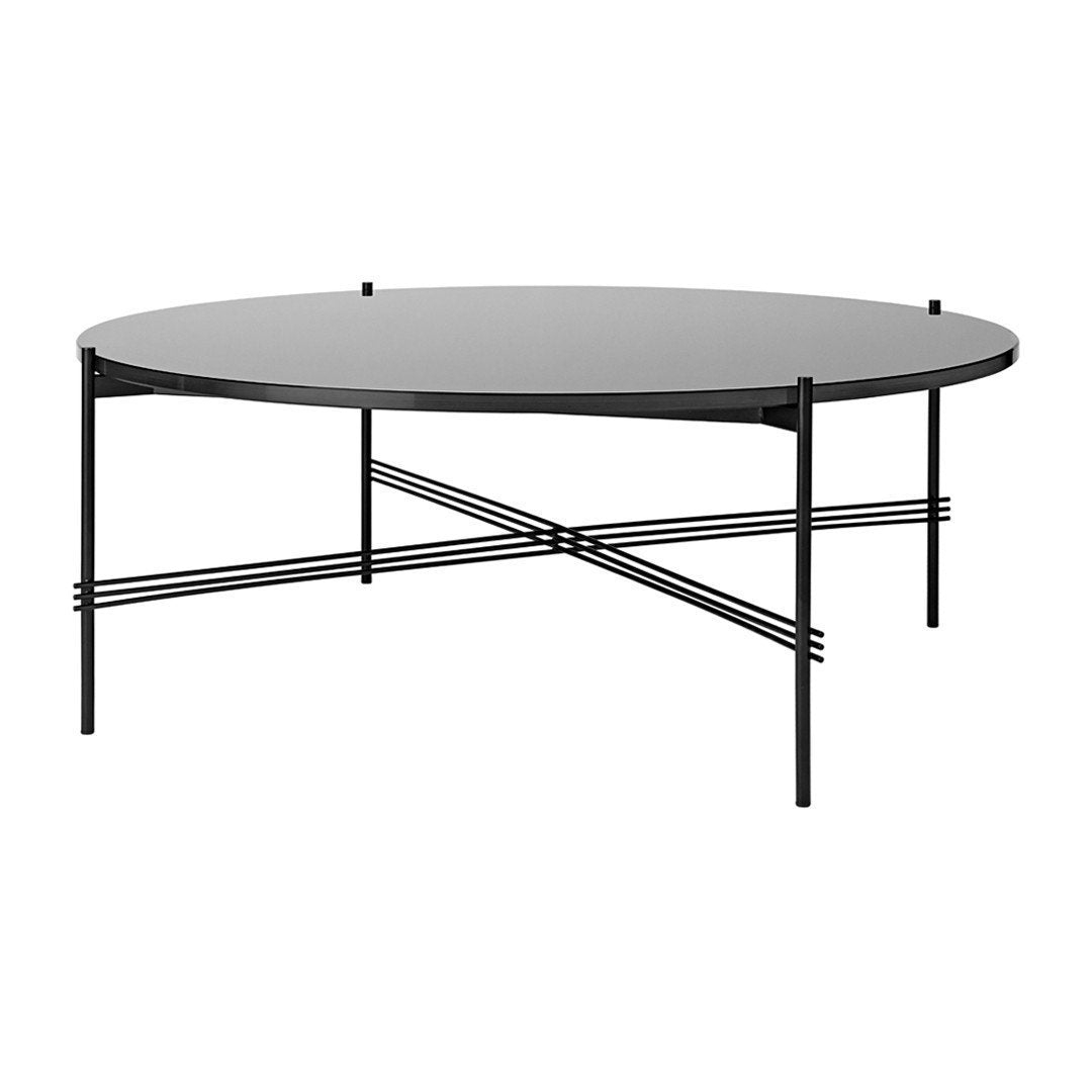 Round black coffee table with a sleek matte finish and minimalist black metal legs featuring an intersecting design.