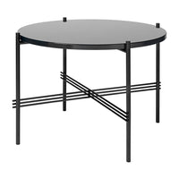 Black round table with a sleek top, featuring minimalistic geometric patterns in the base for a modern look.