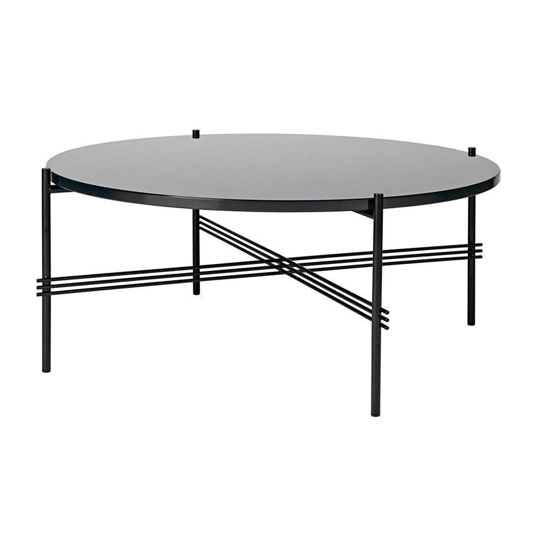 Black round coffee table with sleek, modern design and intersecting black metal legs.