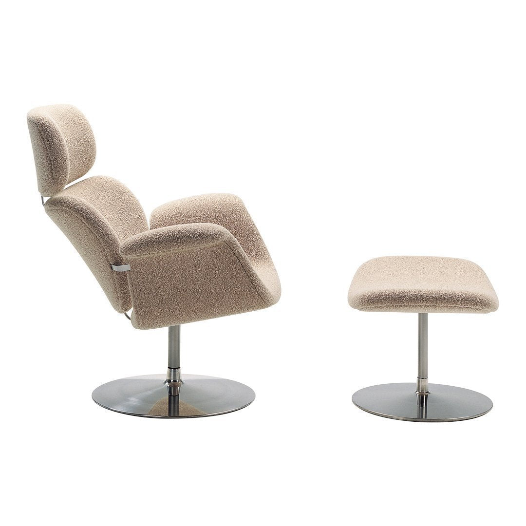 Beige upholstered swivel chair and matching ottoman with sleek chrome base, showcasing a modern minimalist design.