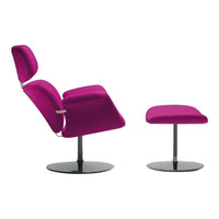 Vibrant magenta lounge chair with matching footrest, sleek black base, perfect for modern decor.