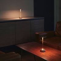 Stylish modern lamp with a warm gold and brown color scheme, creating a cozy ambiance in a contemporary setting.