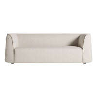 Soft beige sofa with a textured fabric, featuring a minimalist design and smooth, rounded edges. Perfect for modern decor.