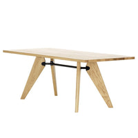 Light natural wood dining table with a sleek design and contrasting black metal support, featuring clean lines and geometric patterns.